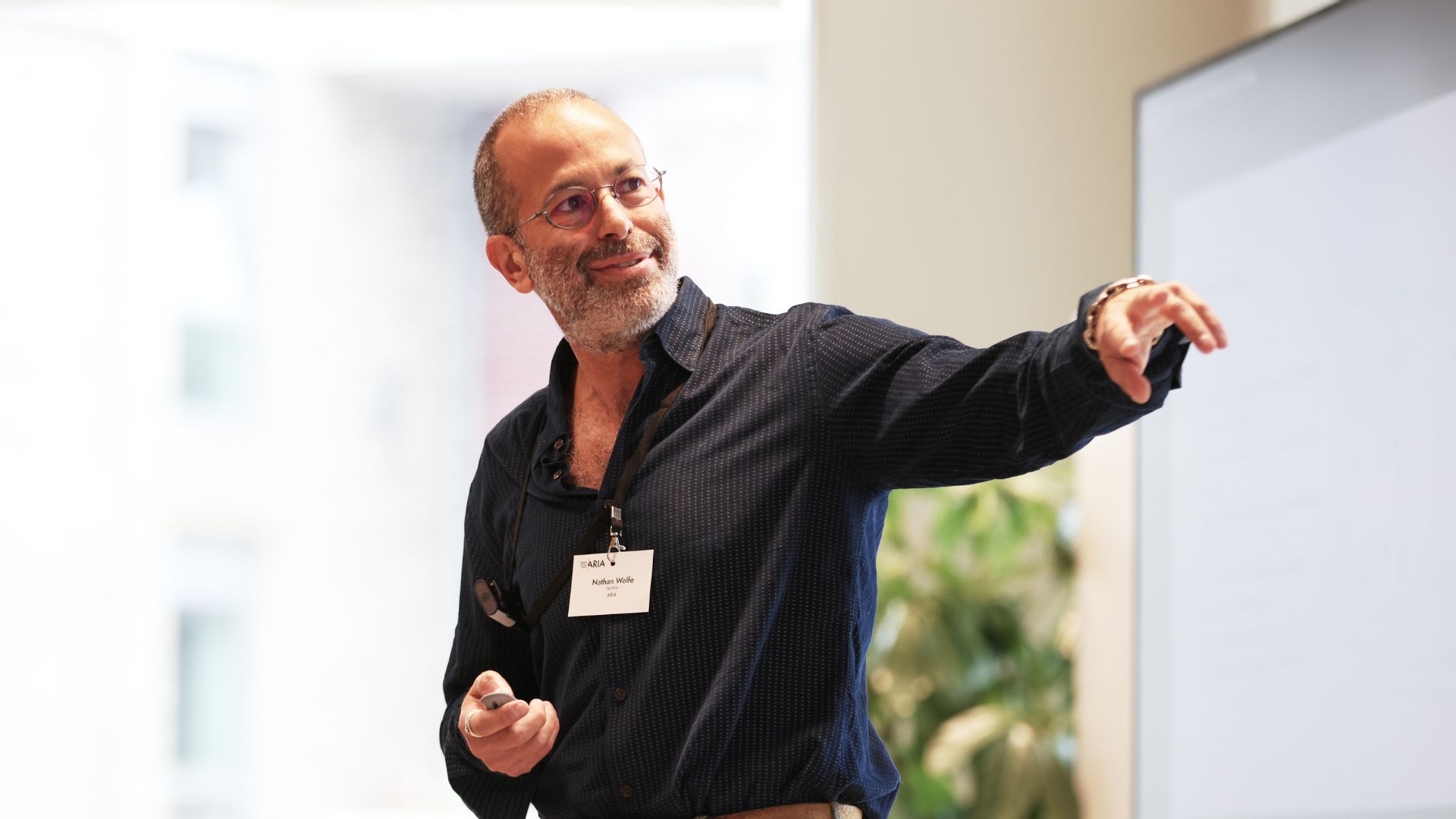 Photo of Programme Director Nathan Wolfe doing a talk
