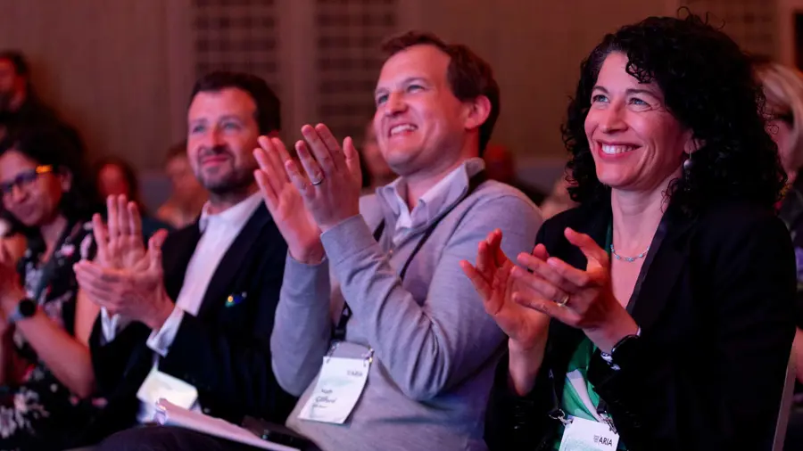 Members of the Aria Summit audience clapping