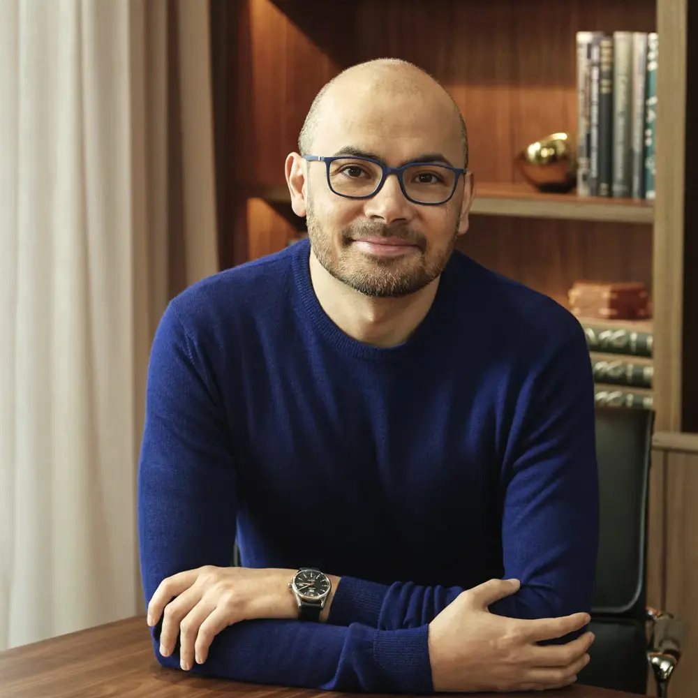 Photo of Sir Demis Hassabis sitting in an office